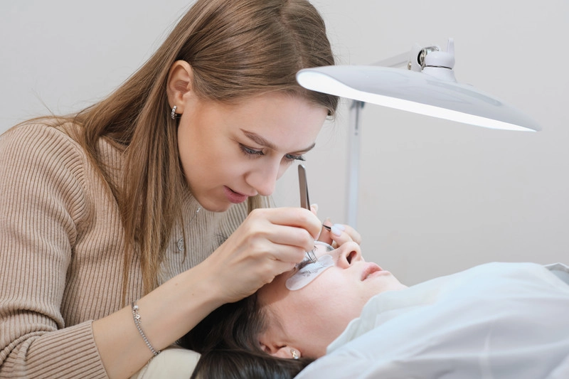 Lash Artists applying eyelash extensions