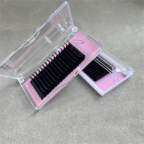 0.03 volume lash extensions displayed in clear plastic trays, featuring neatly arranged ultra-fine black lashes for professional lash artists