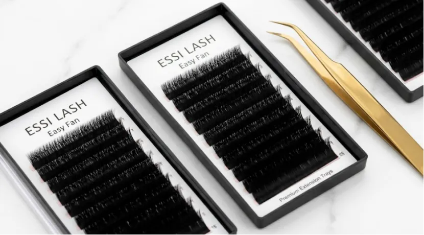 ESSI LASH Easy Fan product trays and tweezers on marble.