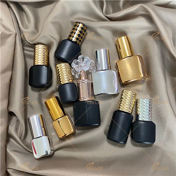 Assorted small cosmetic bottles on silk fabric